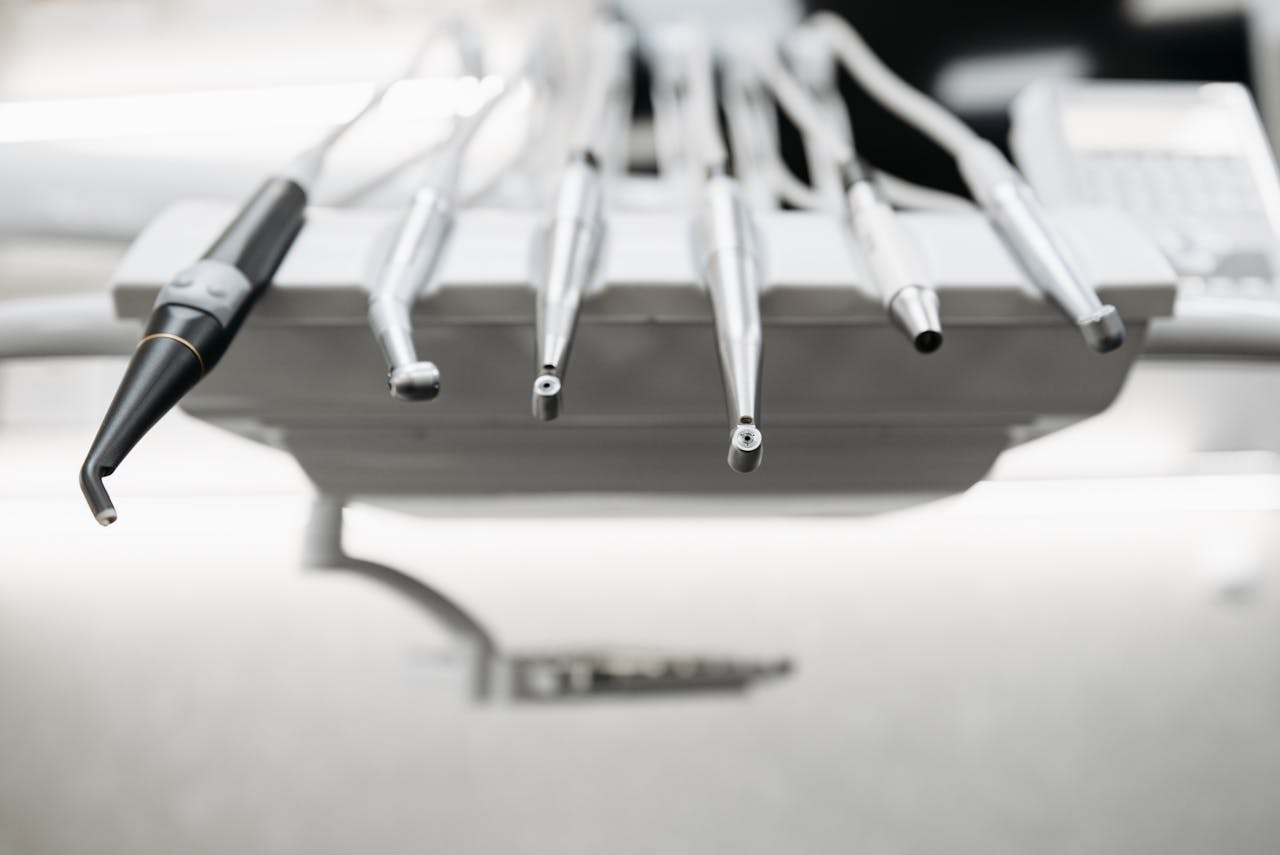 Close-up view of modern dental instruments in a clinical setting, showcasing professional equipment.